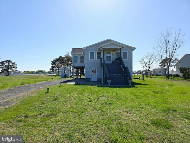 2508 Old House Point Rd, Fishing Creek, MD 21634 - view of front of home with stairway, a front yard, and gravel driveway