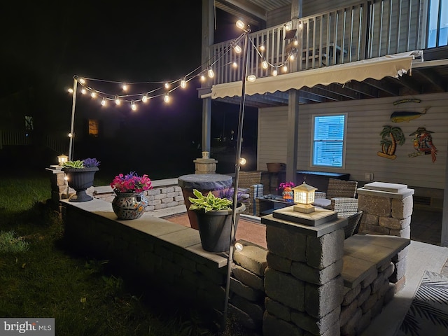 2508 Old House Point Rd, Fishing Creek, MD 21634 - patio at night featuring a balcony