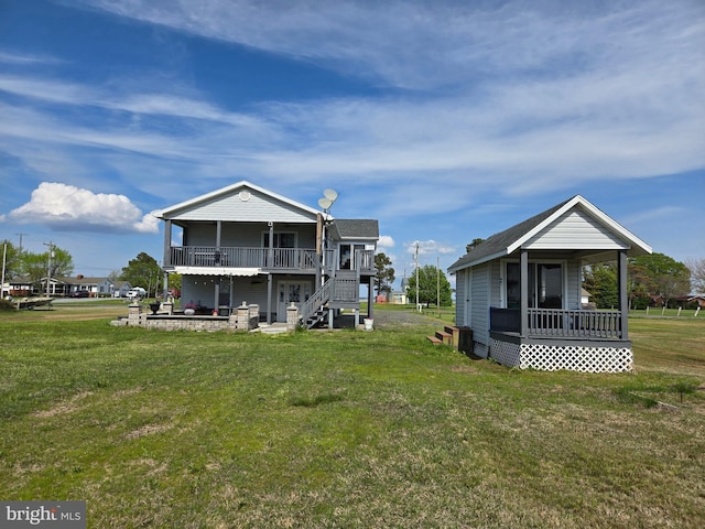 2508 Old House Point Rd, Fishing Creek, MD 21634 - back of property with a yard, stairway, and covered porch
