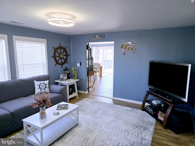 2508 Old House Point Rd, Fishing Creek, MD 21634 - living area featuring baseboards, wood finished floors, and visible vents