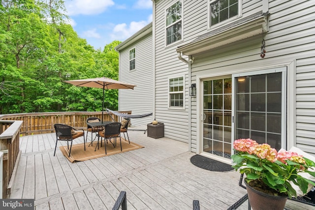 wooden deck featuring outdoor dining space