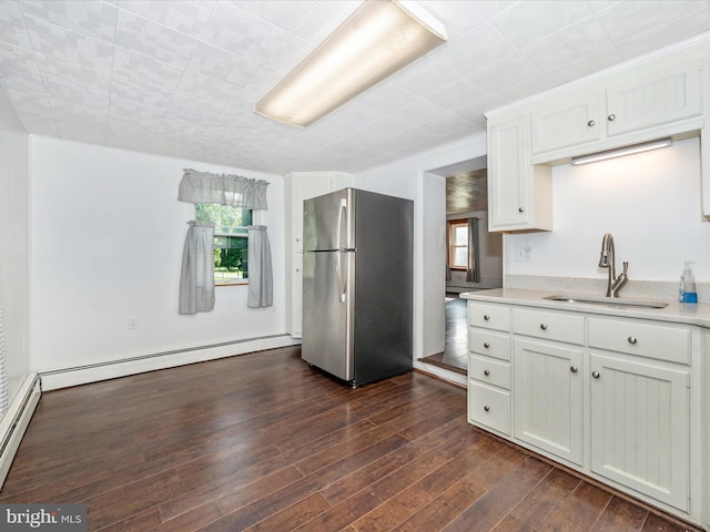 12836 Hessong Bridge Rd, Thurmont, MD 21788 - kitchen featuring baseboard heating, a sink, light countertops, dark wood finished floors, and freestanding refrigerator