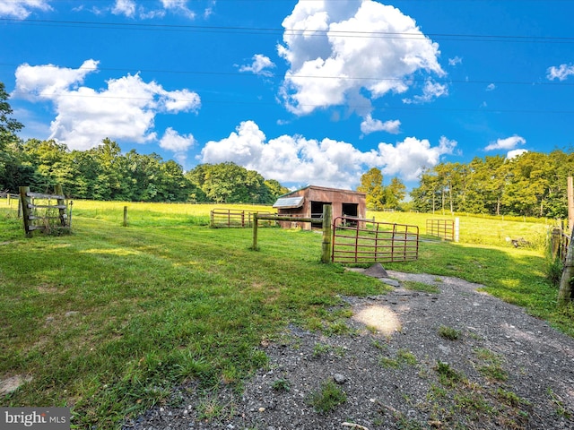 12836 Hessong Bridge Rd, Thurmont, MD 21788 - view of yard with an exterior structure, a rural view, fence, and an outbuilding