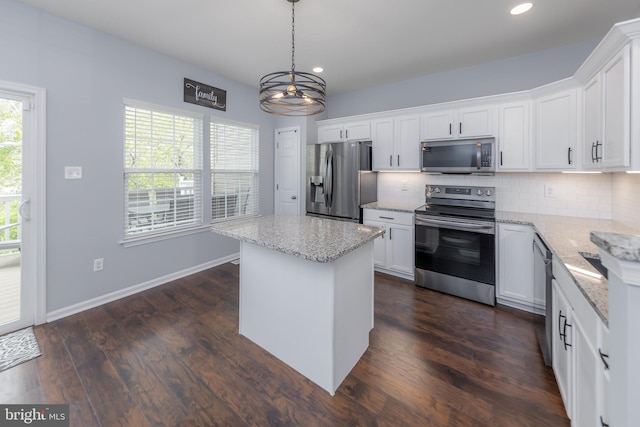 kitchen featuring backsplash, a chandelier, stainless steel appliances, and recessed lighting