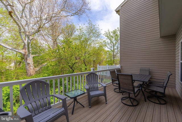 deck with outdoor dining area
