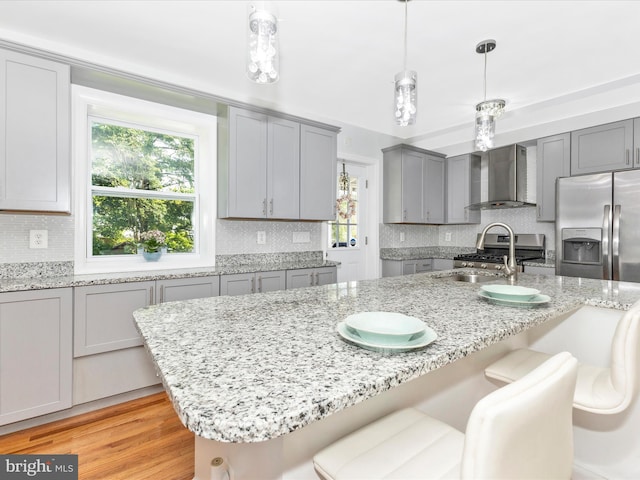 507 Kerwin Ct, Silver Spring, MD 20901 - kitchen with wall chimney range hood, gray cabinets, stainless steel appliances, a sink, and tasteful backsplash