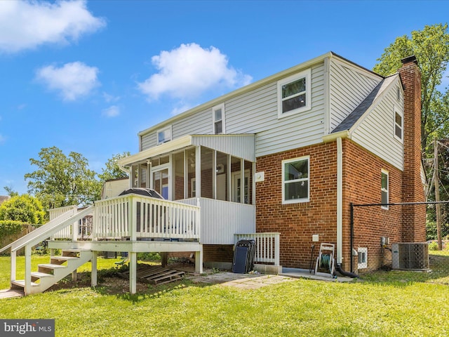 507 Kerwin Ct, Silver Spring, MD 20901 - back of house with a yard, a chimney, brick siding, and central AC unit