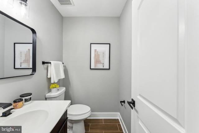 3104 Douglas St NE, Washington, DC 20018 - half bath featuring vanity, baseboards, and toilet