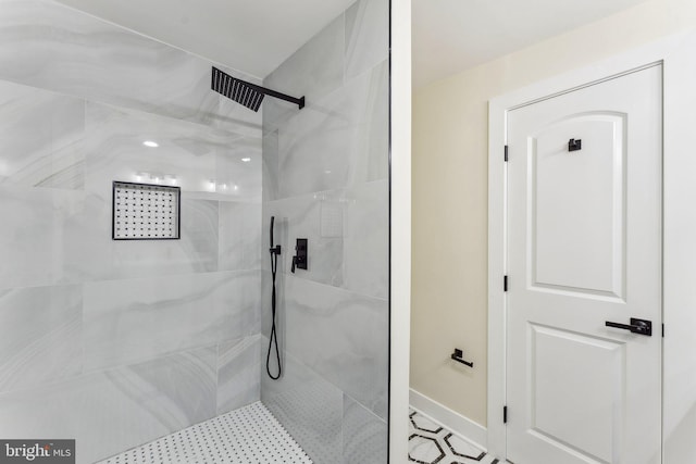 3104 Douglas St NE, Washington, DC 20018 - bathroom featuring tiled shower and baseboards