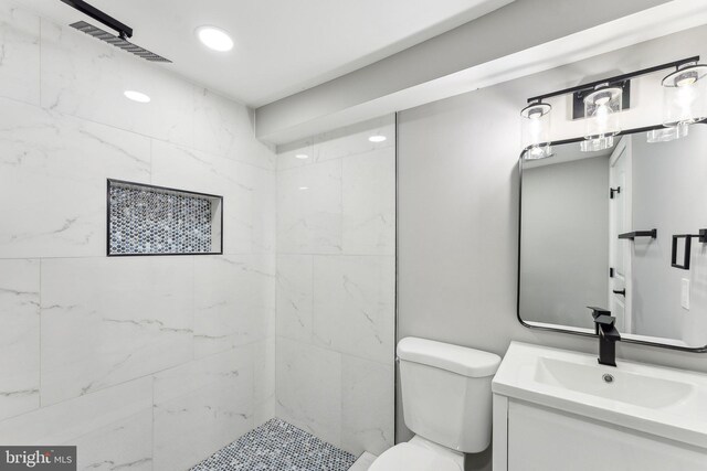 3104 Douglas St NE, Washington, DC 20018 - full bath with vanity, toilet, and a tile shower