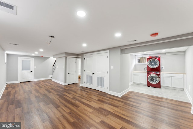 3104 Douglas St NE, Washington, DC 20018 - finished basement featuring stacked washer / drying machine, wood finished floors, recessed lighting, and baseboards