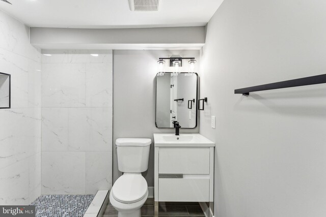 3104 Douglas St NE, Washington, DC 20018 - full bathroom featuring vanity, toilet, and tiled shower