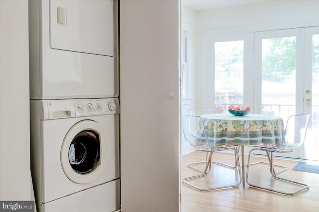 laundry room with laundry area and stacked washer / dryer