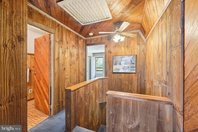 interior space with wood walls and wood ceiling