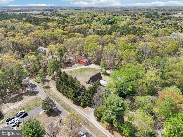 bird's eye view featuring a wooded view