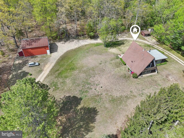 drone / aerial view with a view of trees