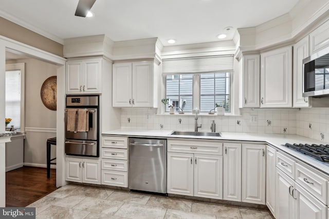 40 Treaty Elm Ln, Haddonfield, NJ 08033 - kitchen with a sink, a warming drawer, light countertops, white cabinets, and appliances with stainless steel finishes