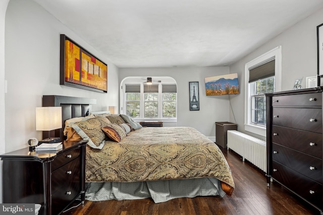 40 Treaty Elm Ln, Haddonfield, NJ 08033 - bedroom featuring radiator, arched walkways, and dark wood-style flooring