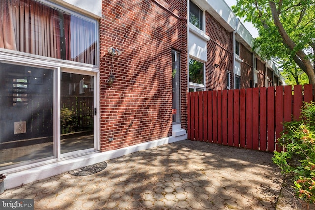 18 University Mews, Philadelphia, PA 19104 - exterior space with fence, a patio, and brick siding