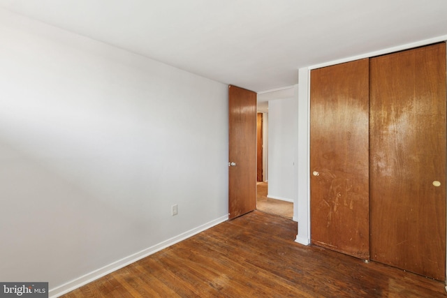 18 University Mews, Philadelphia, PA 19104 - unfurnished bedroom featuring baseboards, wood finished floors, and a closet