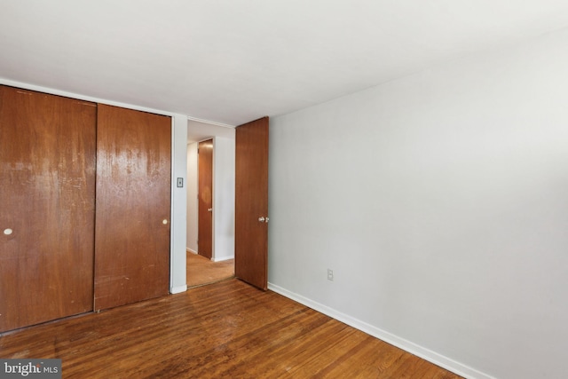 18 University Mews, Philadelphia, PA 19104 - unfurnished bedroom with a closet, baseboards, and wood finished floors