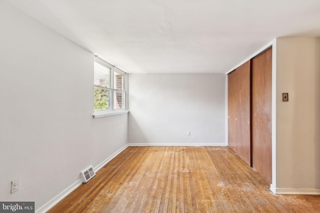 18 University Mews, Philadelphia, PA 19104 - unfurnished bedroom featuring light wood-style floors, baseboards, a closet, and visible vents