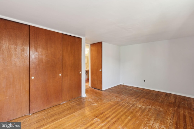 18 University Mews, Philadelphia, PA 19104 - unfurnished bedroom with a closet, baseboards, and wood finished floors