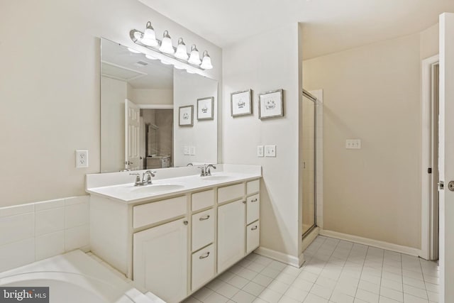 7601 Willow Bottom Rd, Sykesville, MD 21784 - bathroom with a shower stall, tile patterned flooring, double vanity, and a sink