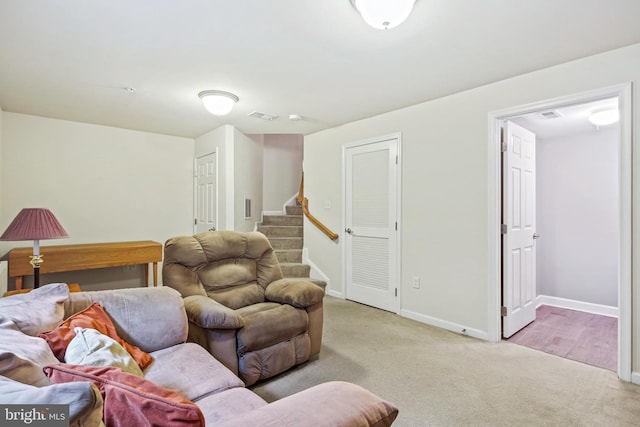 7601 Willow Bottom Rd, Sykesville, MD 21784 - carpeted living room with stairway, baseboards, and visible vents