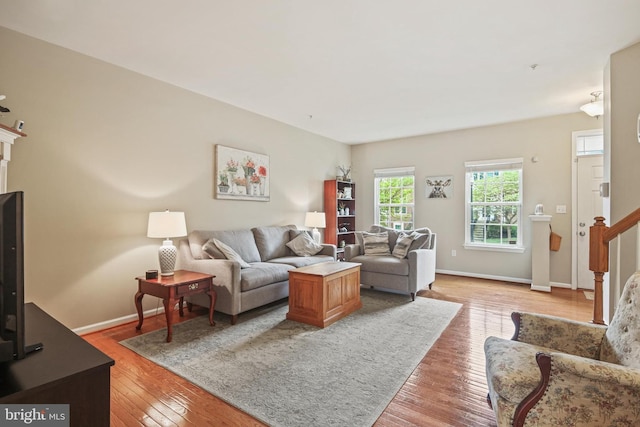 7601 Willow Bottom Rd, Sykesville, MD 21784 - living room featuring light wood-type flooring, baseboards, and stairs