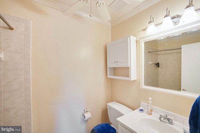 full bath with toilet, a tile shower, visible vents, vanity, and ornamental molding