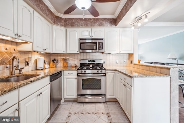 107 Bonnie View Rd, Glen Burnie, MD 21060 - kitchen with appliances with stainless steel finishes, a sink, white cabinetry, a peninsula, and a ceiling fan