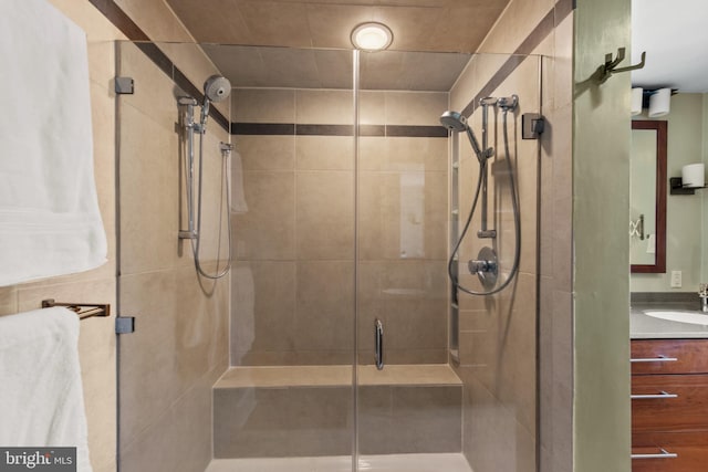 bathroom with vanity and a shower stall