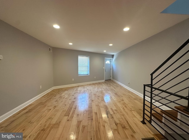 entrance foyer featuring visible vents, stairway, baseboards, recessed lighting, and light wood-style flooring