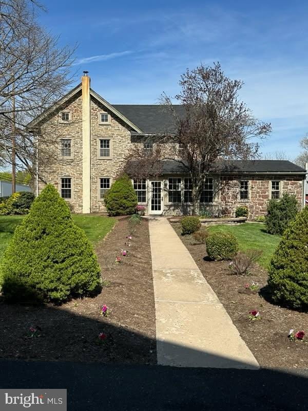 view of front of house with stone siding