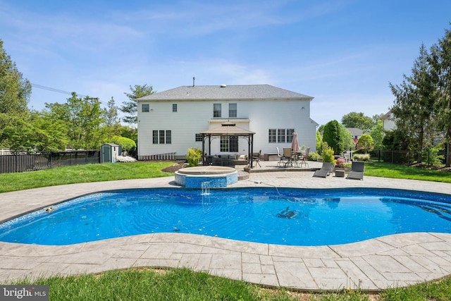 view of swimming pool featuring a gazebo, a fenced backyard, a fenced in pool, and a patio
