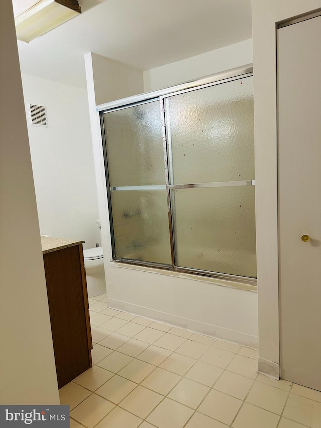 241 Ardmore Ave, Upper Darby, PA 19082 - bathroom featuring visible vents, vanity, tile patterned floors, combined bath / shower with glass door, and toilet