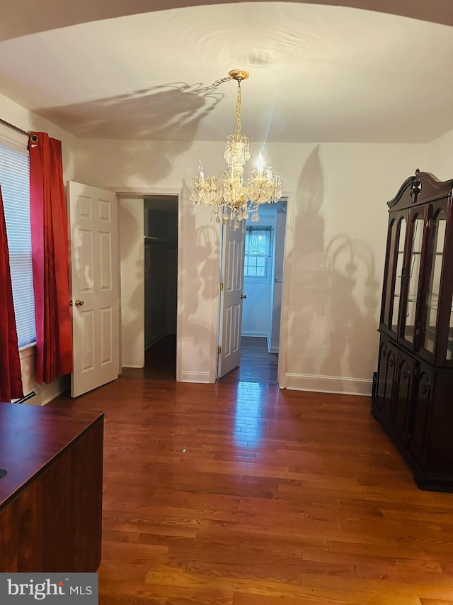 241 Ardmore Ave, Upper Darby, PA 19082 - unfurnished dining area featuring baseboards, a notable chandelier, and wood finished floors