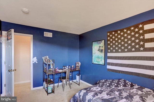carpeted bedroom featuring baseboards and visible vents