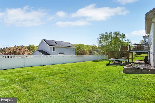 view of yard with stairway, fence, and a deck