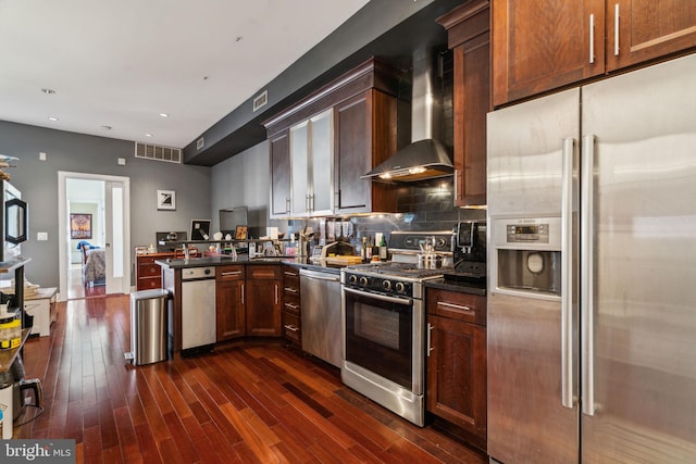 1519 Pine St Unit 7, Philadelphia, PA 19102 - kitchen with dark countertops, wall chimney exhaust hood, stainless steel appliances, and visible vents