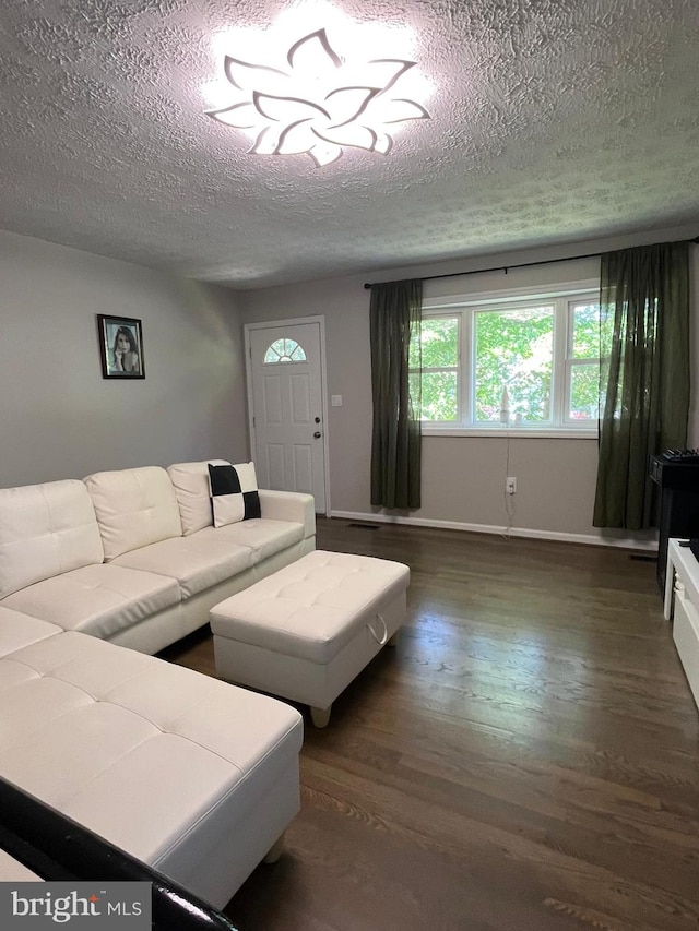 229 Old Line Ave, Laurel, MD 20724 - living room with a textured ceiling, wood finished floors, and baseboards