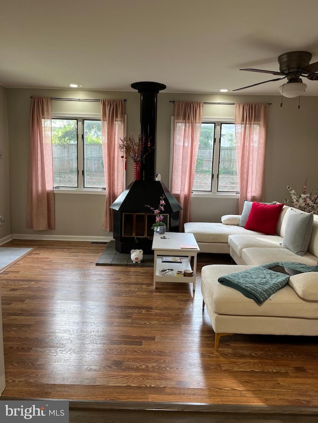 229 Old Line Ave, Laurel, MD 20724 - living room with a wood stove, plenty of natural light, a ceiling fan, wood finished floors, and recessed lighting