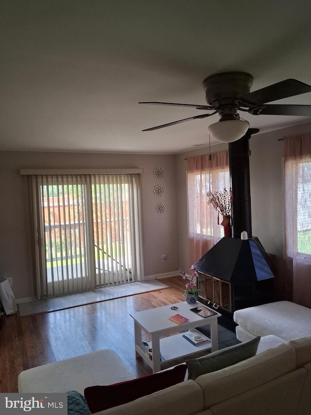 229 Old Line Ave, Laurel, MD 20724 - living room featuring wood finished floors, ceiling fan, healthy amount of natural light, and baseboards