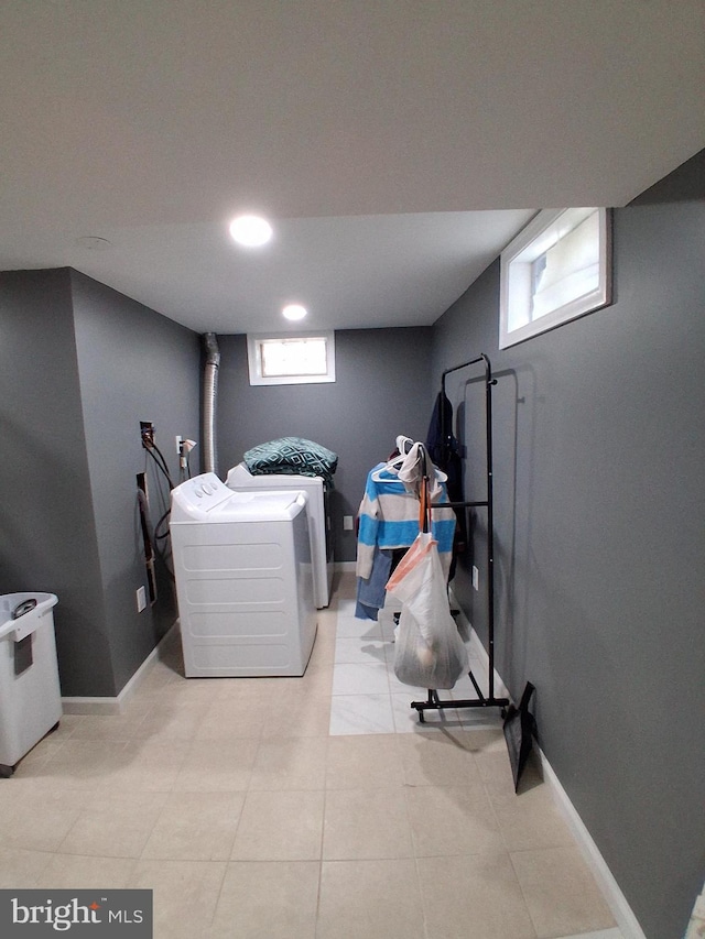 229 Old Line Ave, Laurel, MD 20724 - laundry room featuring washer and dryer, light tile patterned floors, and baseboards