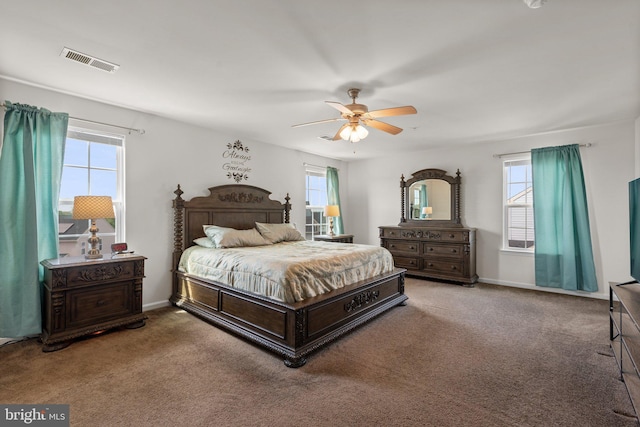 bedroom featuring ceiling fan, carpet flooring, baseboards, and visible vents