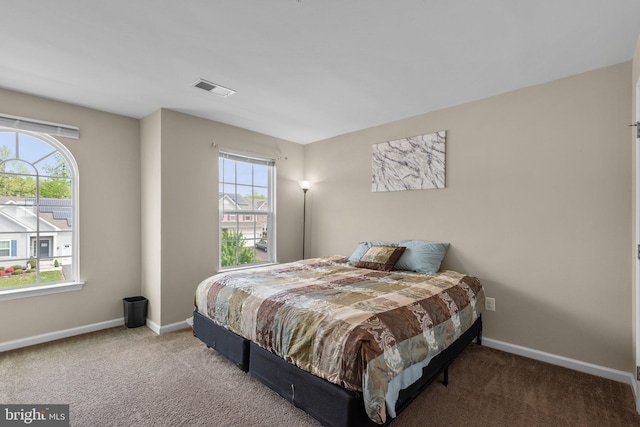 bedroom featuring carpet, baseboards, and visible vents
