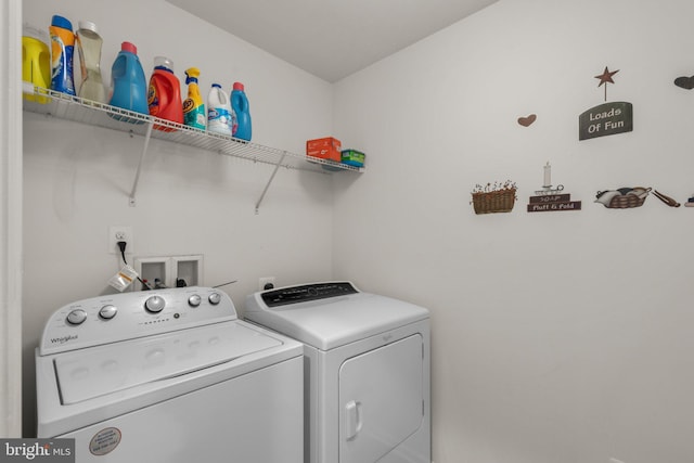 laundry area with laundry area and independent washer and dryer