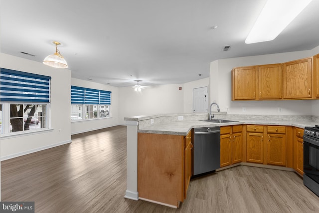 kitchen with light wood-style flooring, stainless steel dishwasher, visible vents, open floor plan, and a peninsula