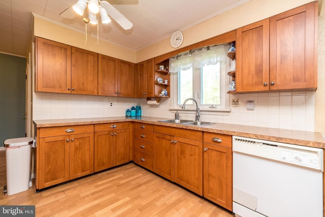 kitchen featuring brown cabinetry, white dishwasher, crown molding, open shelves, and a sink